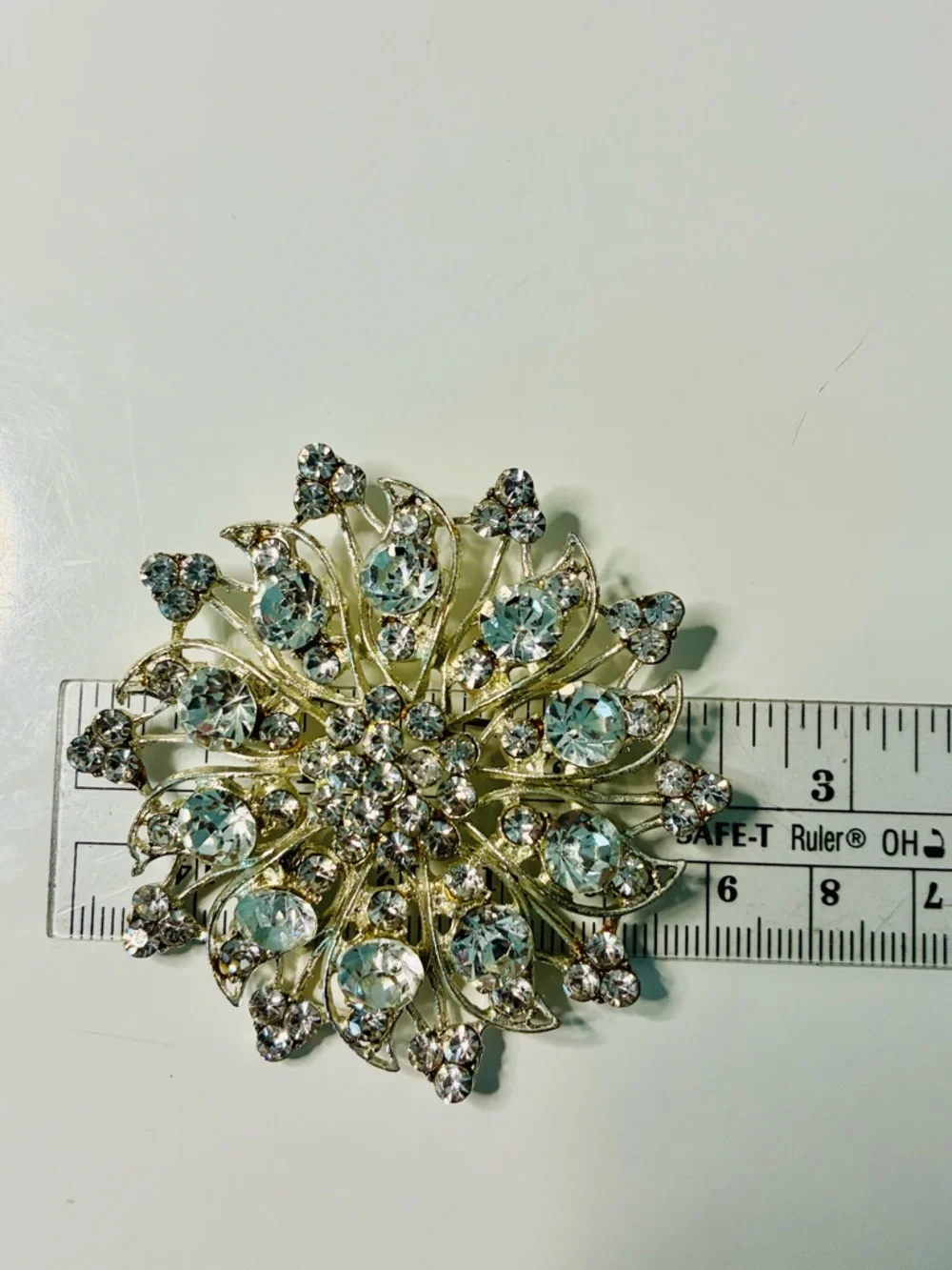 Crystal Floral Burst Brooch - Light Blue Rhinestone Accent